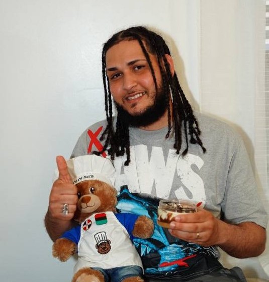 Customer with Zolochi bear giving thumbs up