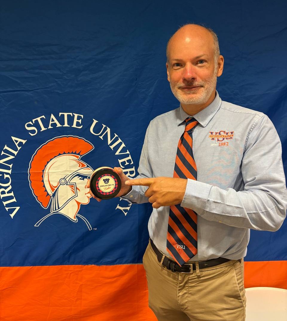 Customer at Virginia State University with Zolochi's cheesecake