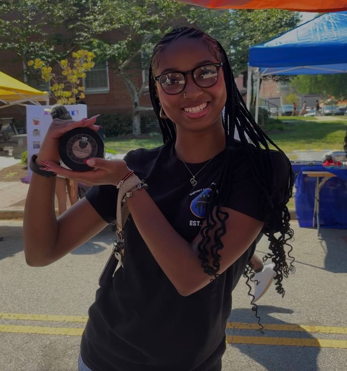 Customer at pop-up holding Zolochi's cheesecake