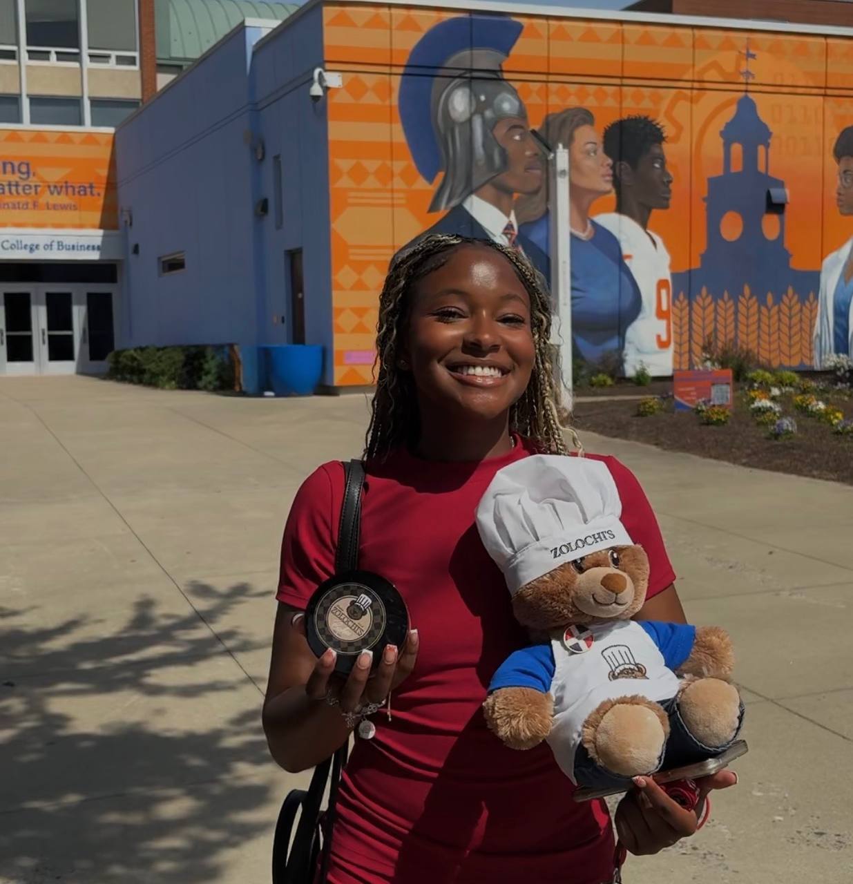 Customer with Zolochi bear at college campus